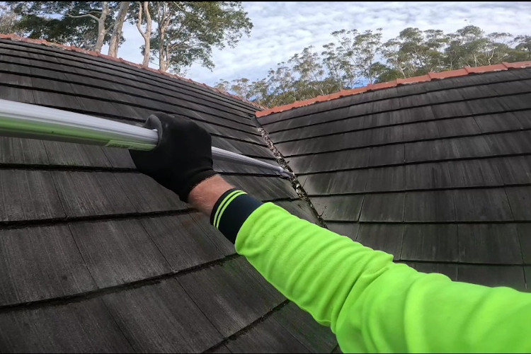 
Pro gutter cleaning with extension poles, ensuring clean valleys on steep roofs in merimbula