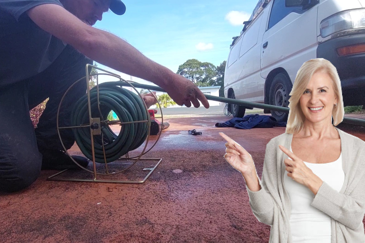 
A hose is carefully stored as a merimbula gutter cleaner finishes up a day of rinsing.